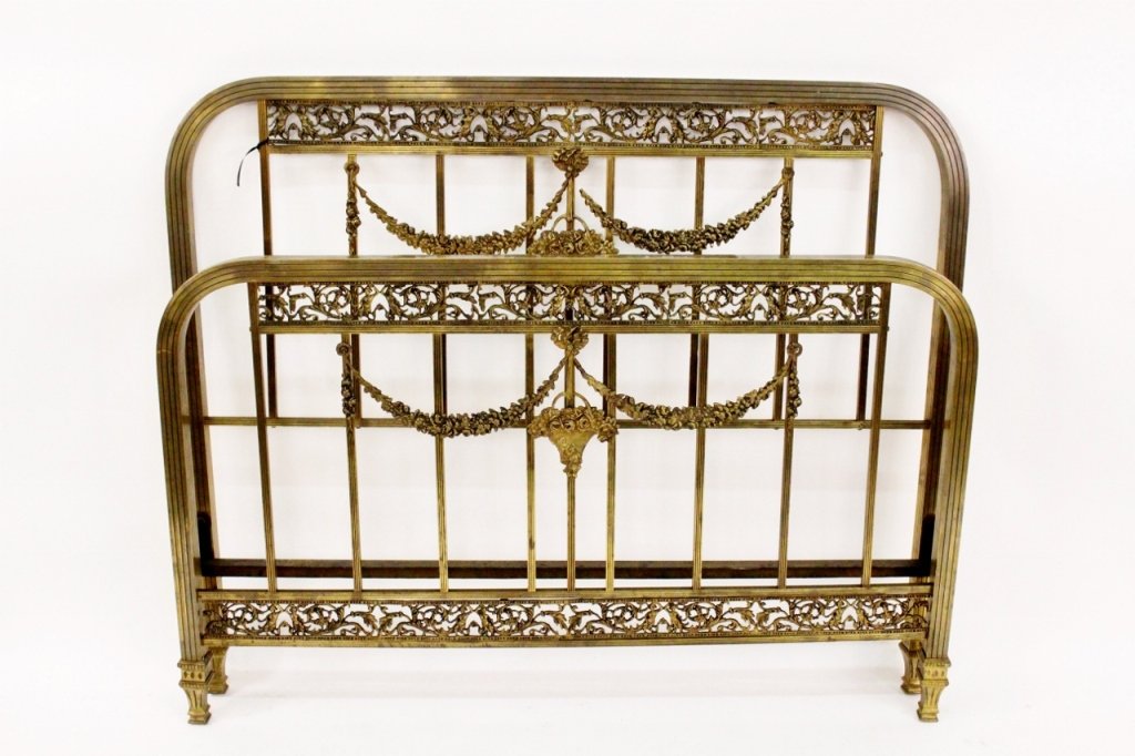 French Louis XVI Style Brass Bed: French, 20th century. Louis XVI style brass metal single twin sized bed frame with floral urn and swag decoration throughout as well as figural and scrolled foliate banding. Feet of headboard and foot