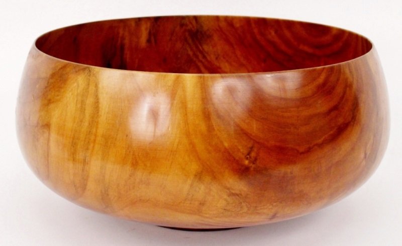Ed Moulthrop Lathe Turned Wild Cherry Center Bowl: Edward Moulthrop (American (Georgia), 1916-2003), carved, lathe turned, and varnished wood bowl composed of wild cherry. Bowl with wide body above squat circular foot. Stamped, signed, and wood indica