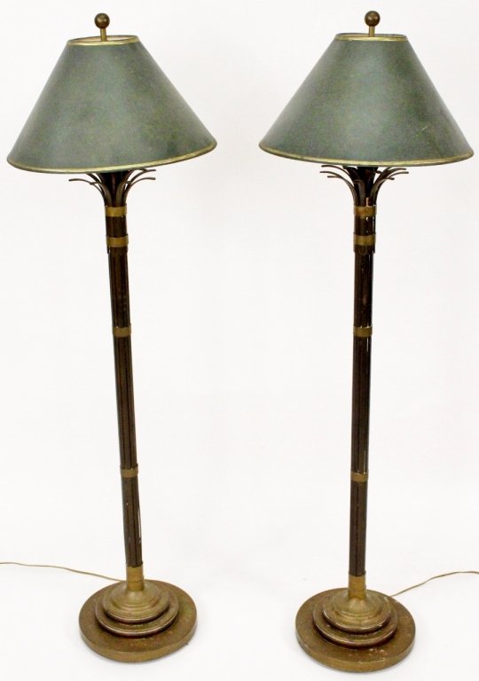 Pair of Metal Bamboo Motif Floor Lamps: Continental School, 20th century. Pair of matching metal bound and simulated bamboo floor lamps headed with leaf tips. Each electrified lamp with two lights surrounded by a tapered dark green and gilt