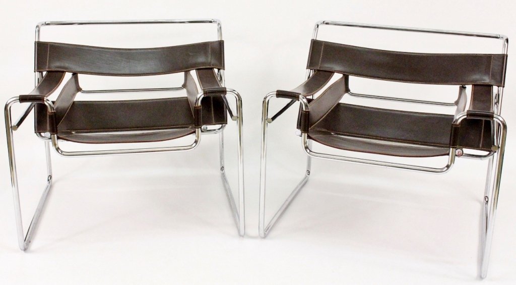 Pair of Wassily Lounge Chairs After Marcel Breuer: Italian, 20th century. After Marcel Breuer (Hungarian, 1902-1981), pair of matching iconic mid century modern design Wassily style lounge chairs with a bent tubular steel frame with a polished chromed