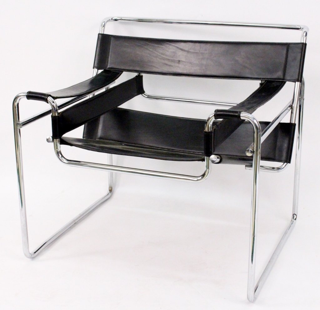 Wassily Lounge Chair After Marcel Breuer: Italian, 20th century. After Marcel Breuer (Hungarian, 1902-1981), pair of matching iconic mid century modern design Wassily style lounge chairs with a bent tubular steel frame with a polished chromed