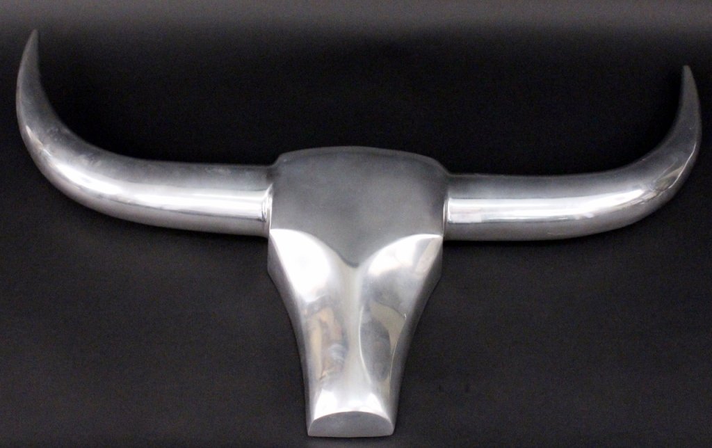 Chromed Metal Modern Longhorn Wall Sculpture: American, 20th century. Cast chromed metal animal head mount in the form of a sleek and streamlined longhorn or steer. Unmarked. Hook on back of wall sculpture for mounting. Approximate height 23.5",