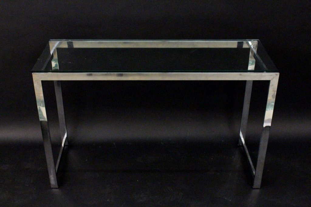 Modern Chrome & Glass Parsons Table & Stools: 20th century. Milo Baughman style parsons table or sofa table with tubular chrome metal frame under rectangular glass top with two black upholstered stools with chromed metal frames, with vintage Bon 