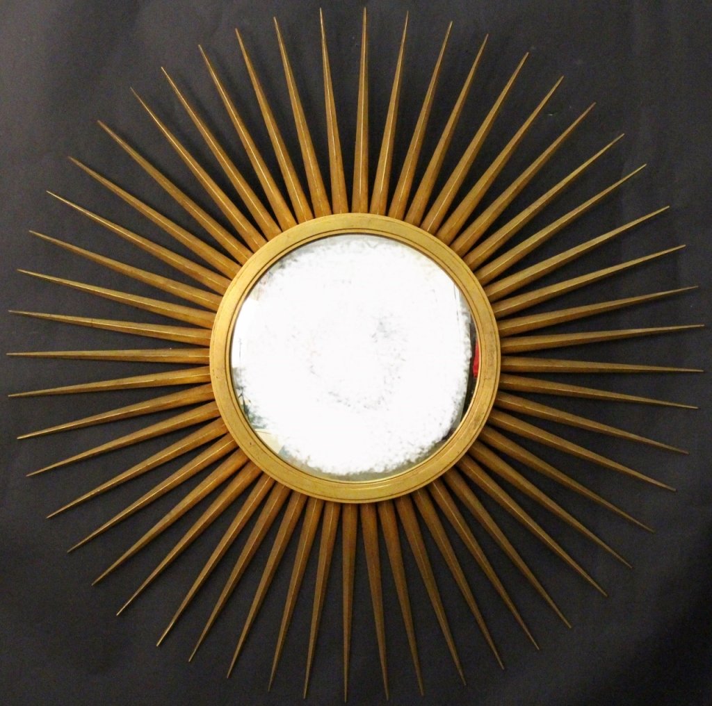 Baker Starburst Giltwood Mirror: Baker Furniture (American, 20th century). Large decorative starburst wall mirror with giltwood rays or radiating spikes surrounding a convex mirror or looking glass at center. Marked "Baker Furniture"