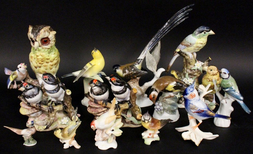 13 Bird Figurines, Meissen, Rosenthal & Others: 20th century. Group of thirteen collectible bird figurines comprising of a Meissen yellow, green and blue feathered bird with crossed pommel sword mark in blue on bottom under glaze; four Rosenthal bi