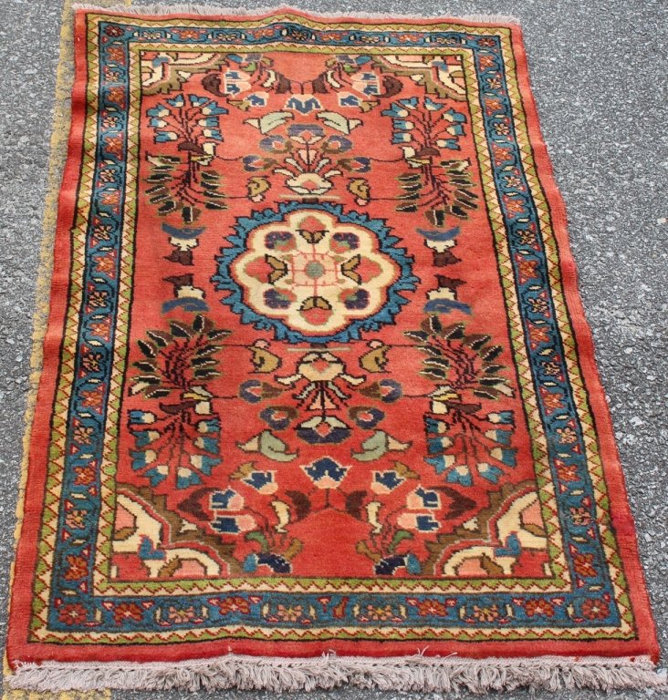 Hand Woven Persian Lilihan Throw Rug: all wool pile. floral on rose background. blue border. gold, green and cream accent colors. measures approximately 2'6 x 4'