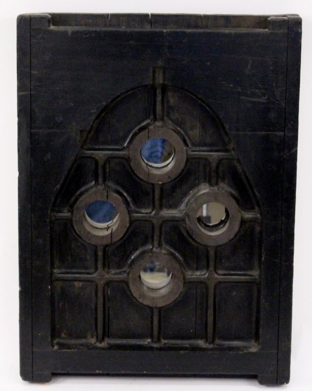 American Stained Oak Mirrored Wall Hanging: American. 20th Century, possibly earlier. Stained oak mirrored wall hanging with arched niche enclosing four small interlocking convex mirrors. Marked on the side 172891 and 6445. Height 33.5", width