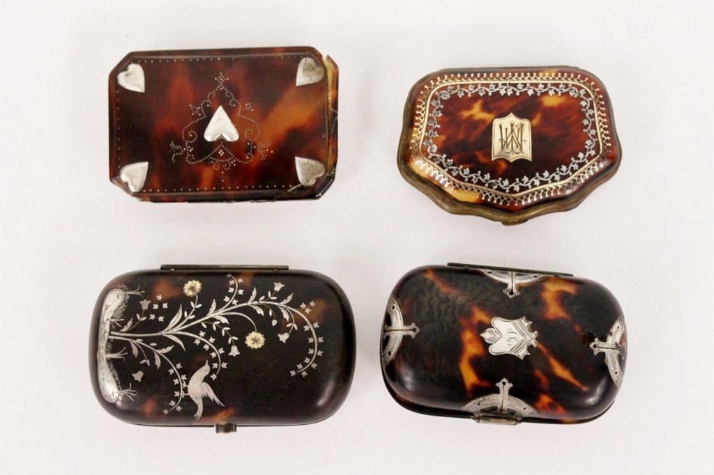 Group of Four Tortoiseshell Silver Overlay Items: Group of four diminuitive tortoise shell items decorated with fine silver or silvered metal on exterior comprising of a rectangular box with rounded corners with monogrammed shield and arched accents 