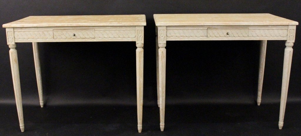 Pair of Stands w/Distressed Painted Finish: Pair of one drawer stands with distressed light grey colored painted finish. Rectangular top above carved apron with rosette medallions at corners above tapered and fluted legs. Each with small pull o