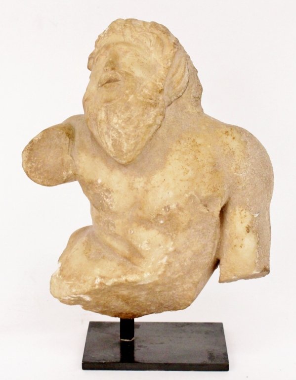 Carved Marble Sculptural Fragment of a Nude Satyr: Probably Syrian. Greek style finely rendered carved marble sculptural fragment of a classically styled nude male satyr with curled and wavy hair, long beard and pointed ears. Figure with twisting tors