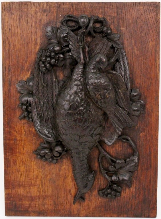 Black Forest Carved Game Plaque: Late 19th/early 20th century Black Forest style carved oak trophy or hunting game plaque, the rectangular panel mounted with carved hanging fowl, probably pheasant and dove along with acorn and oak le