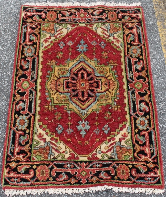 Hand Woven Serapi Throw Rug: all wool pile. floral on rose background. green, red, blue and black accent colors. measures approximately 2.1 x 3
