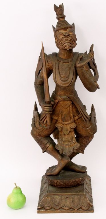 Thai Carved Wood Sculpture of Hanuman: Southeastern Asian, Thai carved and stained wood figural sculpture depicting the dancing monkey Hindu god with patterned clothes and tall hat. Figure standing at full length in traditional dancing pos
