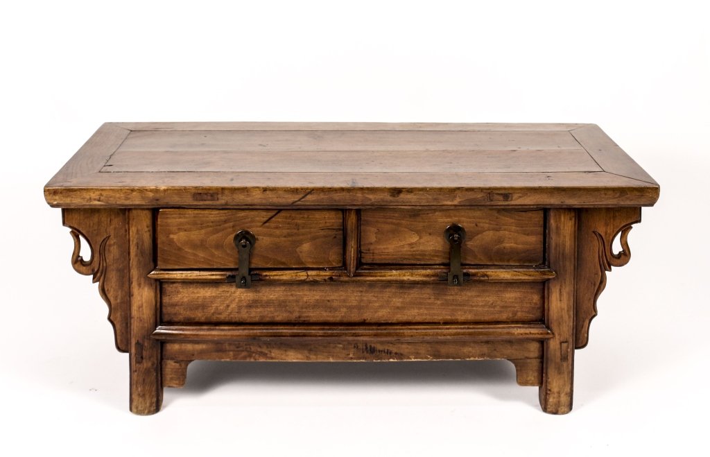 Small Chinese Elm Wood Low Altar Table: Chinese, 19th century. Small elm wood low altar table with two pull out drawers under rectangular top with elongated metal pulls. Carved shaped bracket accents on sides. Height 14.75", width 37", dept