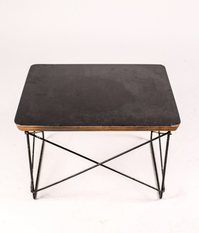 Eames for Herman Miller LTR Stool: Charles (American, 1907-1978) and Ray Eames (American, 1912â€“1988) for Herman Miller, mid century modern LTR stool with black laminate rectangular top with curved corners above plywood top on bl