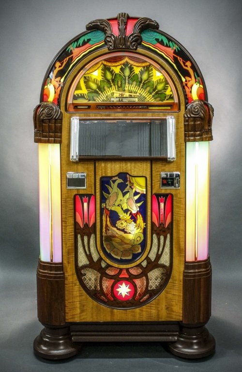 Rock-Ola "Nostalgia CD-6B" Jukebox: American (Californian), Late 20th century. Rock-Ola compact disc "Nostalgia CD-6B" compact disc electric jukebox with Advanced SyberSonic Electronics to play music with quality sound. Cabinetry by Ant