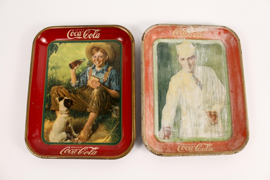 Two Coca Cola Metal Advertising Trays: American, first half of 20th century. Group of two Coca Cola advertising rectangular metal serving trays with raised rims comprising of an American Art Works Inc. (Coshocton, Ohio) for The Coca-Cola C