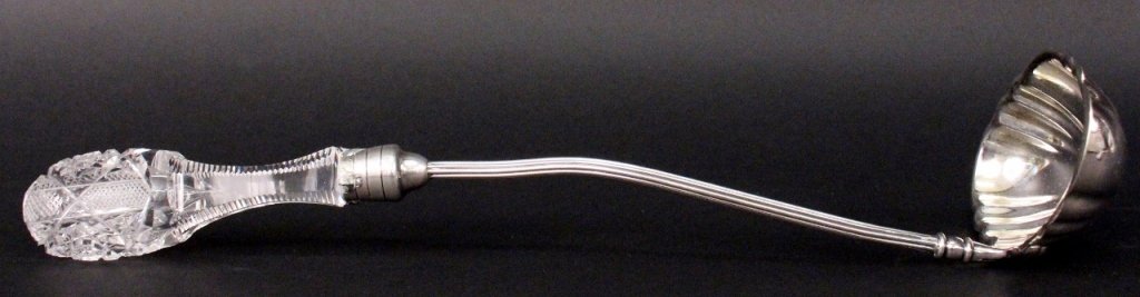 American Brilliant Period Cut Glass Punch Ladle: Bergen & Company (American, Late 19th/Early 20th century), American Brilliant period cut glass and silverplate punch ladle. Serving utensil with cut glass handle connected to redded thin shaft connect