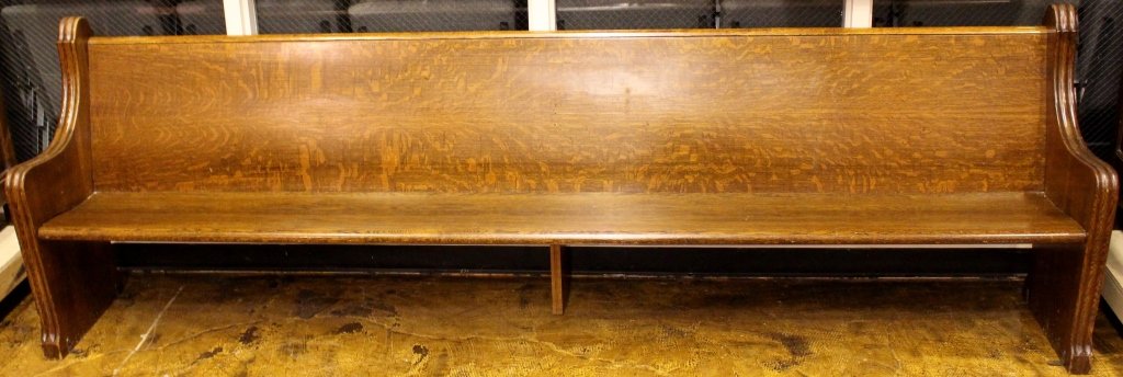American Oak Carved Church Pew 10' Long: American. Early 20th century. Extra long oak church pew carved to each end with scrolled reeded arms and arches. Height 36.75", width 120", depth 15.25", seat height 16"._x000D_ Please consult the add