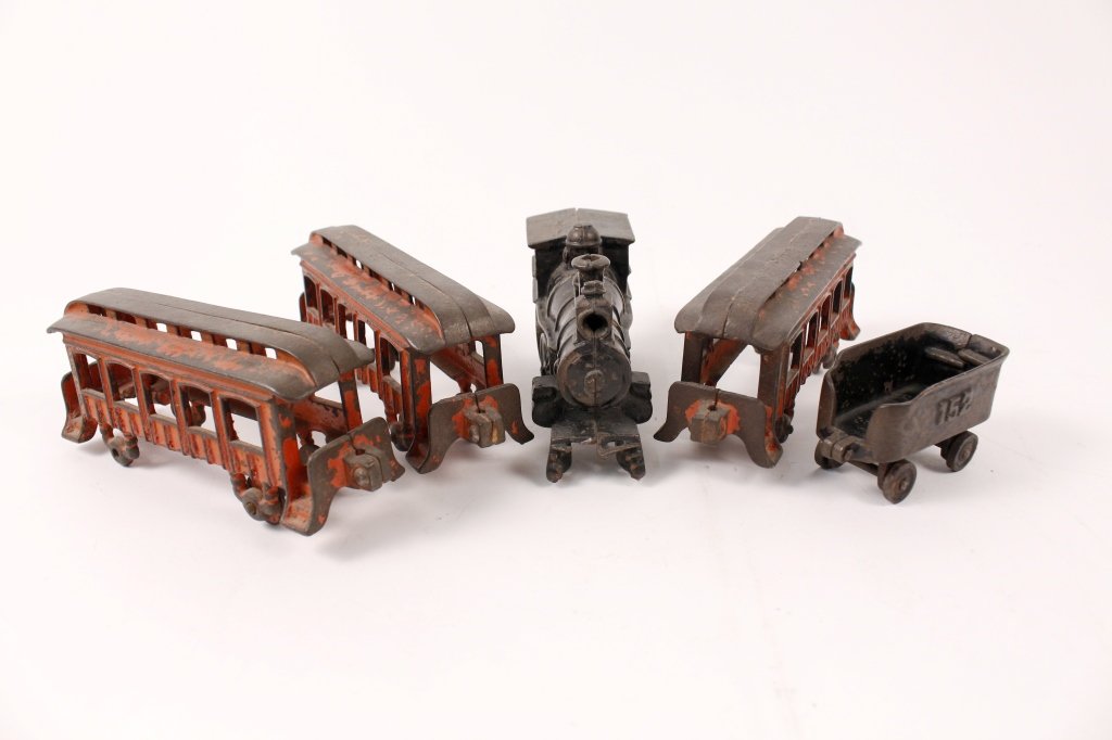 19th Century 5 PC Cast Iron Train Set: American, 19th Century. 5 piece painted cast iron train set with engine, 3 passenger cars and a tender, possibly Buffalo Toy Works Pratt & Letchworth. Apparently unmarked except for number on tender 1