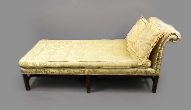 English 18th C. Mahogany Framed Day Bed: English, 18th century. George III mahogany wood framed day bed or chaise lounge with rolled back rest accented with brass nail heads. Day bed upholstered in yellow damask fabric on loose rectangular c