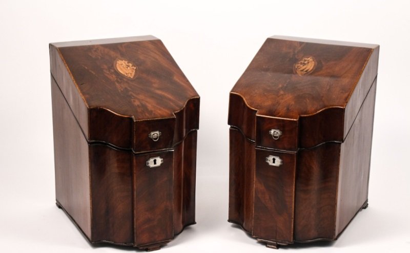 Pair of 18th C. Knife Boxes w/ Satinwood Inlay: English, Late 18th Century. Matched pair of knife boxes, Hepplewhite Period, in select flame mahogany, the slantfront covers with conch shell & baberpole inlay, serpentine front, fitted interiors, sta