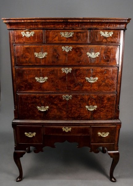 English 18th C. George III Burled Walnut High Boy: English, 18th Century. George III burled walnut highboy, the upper case with the rectangular ogee molded cornice above three short drawers over three long graduated drawers, the chamfered corners deep
