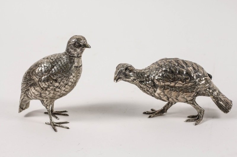 Two English Silver Models of Quail: England, Late 19th/early 20th Century. Two English silver quail game birds, one model with import marked for London, 1920 by Berthold Hermann Muller, British importer of Hanua silver, height 4.5", wid