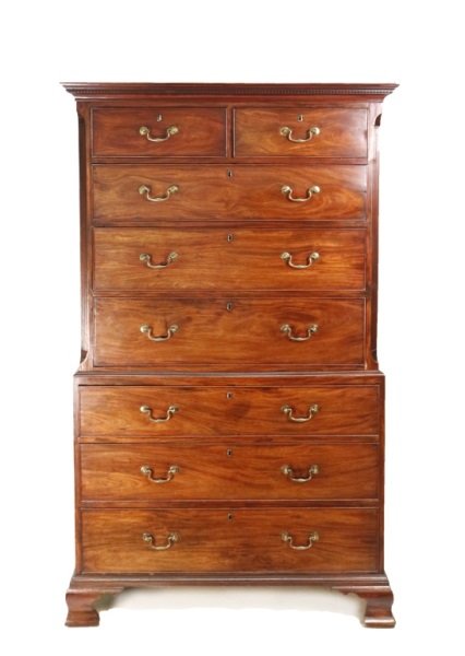 George III Mahogany Chest on Chest: English, 18th Century, circa 1870. George III mahogany chest on chest, two-case construction, upper case with dentil molded cornice, fluted and chamfered lamb's tongue corners, with two short over thr