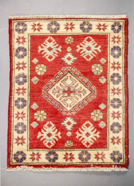 Hand Woven Kazak Throw Rug: wool, floral on burgundy field with cream, blue and green accent colors. measures approximately 2.4 x 2.10 .Please consult the additional photos provided and ask all pertinent questions (i.e. conditio