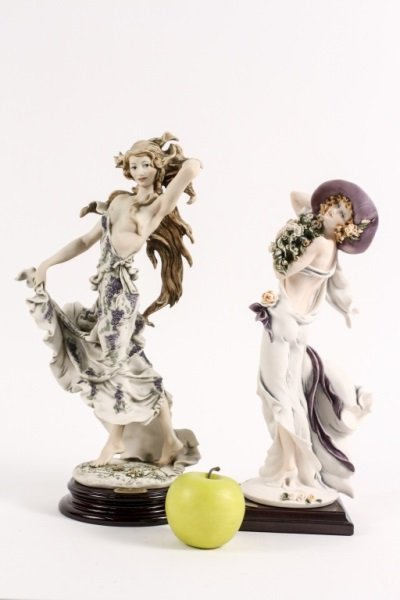 2 Giuseppe Armani Sculptural Figurines: Italian, 20th Century. 2 Giuseppe Armani sculptural figurines entitled "Playful Breeze" & "Celebration". Both figurines mounted on wood stands in the original box. Playful Breeze comes with Limited Ed