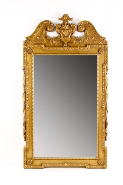 Louis XVI Style Mirror w/Gold Finish: 20th century. Louis XVI style decorative wall mirror with gold painted finish with broken swan's neck scrolled pediment at top with shield form medallion at center with scrolled foliate, rosette and d