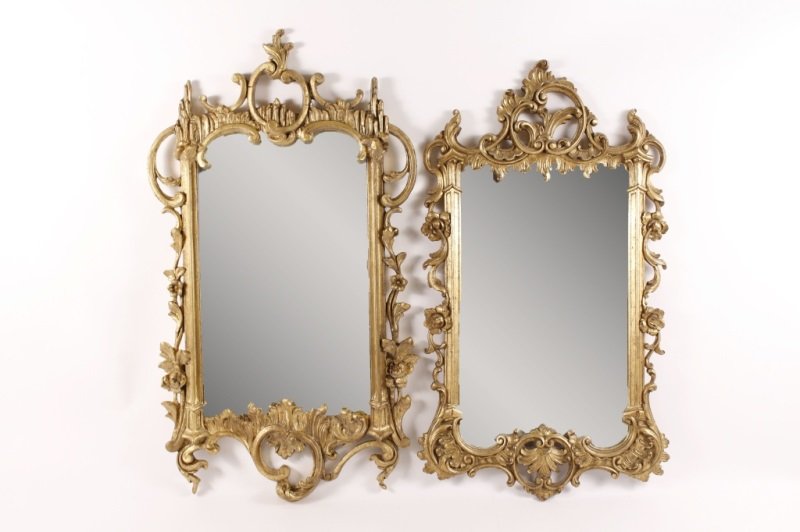 Pair of Rococo Style Giltwood Mirrors: American, Circa 1950. Pair of New York Rococo style giltwood mirrors, of "Syroco Wood" by Syracuse Ornamental Co. Inc., the rectangular wood molded frame surmounted with acanthus and C scroll pierced
