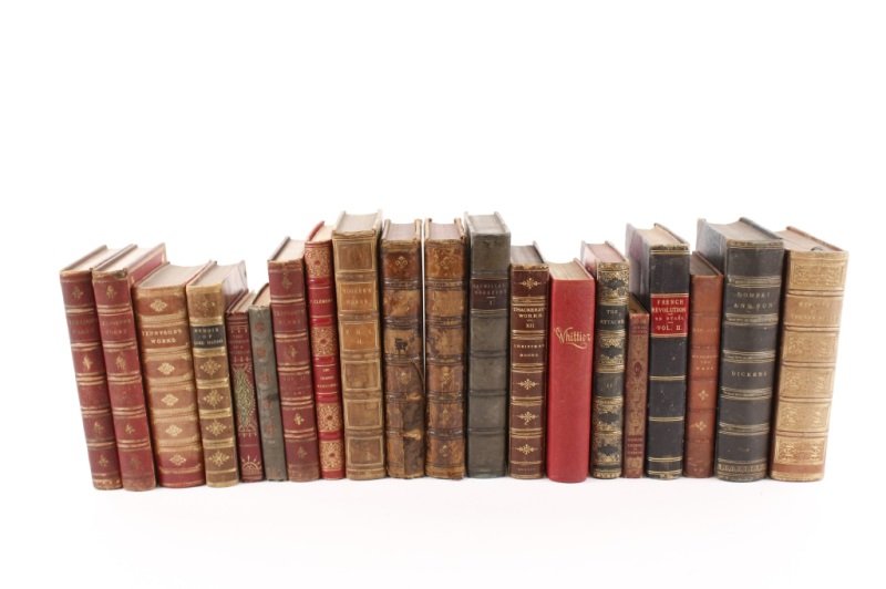 Group of Twenty 19th Century Leather Bound Books: A collection of 20 books comprising of "The Attache; or Sam Slick in England", Volume 2 of 2, published in London by Richard Bentley in 1844; "Dombey and Son" by Charles Dickens with illustrations by 