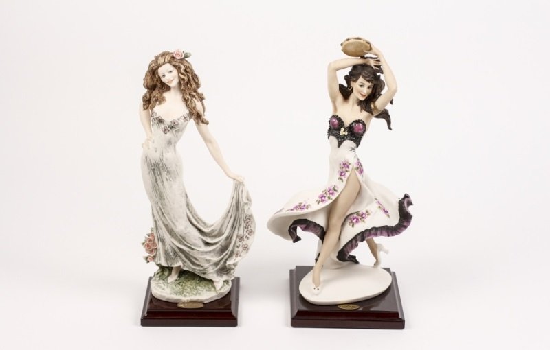 2 Giuseppe Armani Sculptural Figurines: Italian, 20th Century. 2 Giuseppe Armani Sculptural Figurines entitled "Celebration" and "Gypsy Dancer". Both figures mounted onto wood stands. Celebration height 12.75", width 5.5". Gypsy Dancer heig