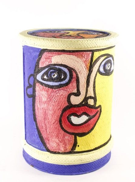 Peter Keil Hand Painted Portrait Drum Table: American/German, 20th Century. Peter Robert Keil (b. 1942 - ) paint decorated circular drum side table, woven of either wicker or rattan, with single door shelved interior on conforming base. The tabl