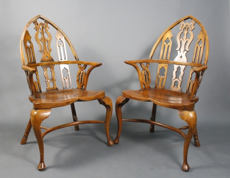 Pair of Gothic Windsor Yew Wood Armchairs: 20th century. Pair of Gothic Windsor yew wood armchairs with pointed pierced rounded back in Gothic Revival style above shaped seat supported by cabriole legs terminating on Queen Anne pad feet at fro