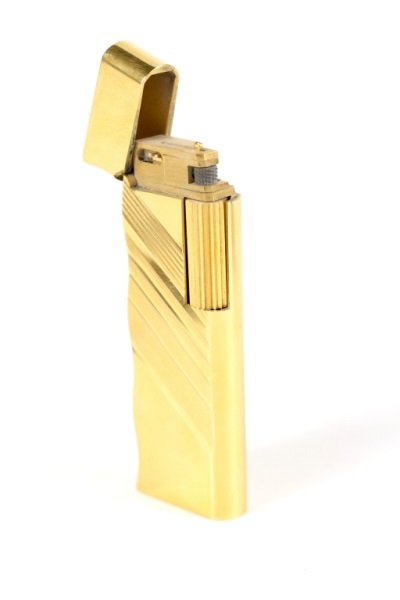 Van Cleef & Arpels Gold Filled Lighter: Van Cleef & Arpels (French, 20th century), gold filled lighter (le briquet) of rectangular form with undulating edge and diagonal banding on both sides. Marked on bottom with "VAN CLEEF & ARPELS PARIS