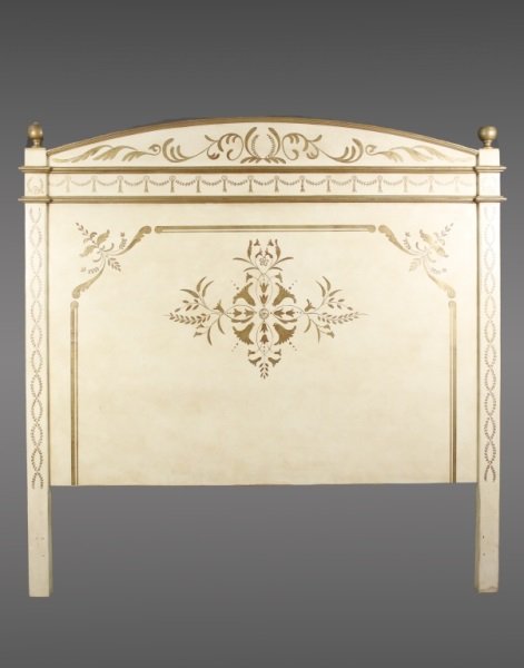 Cream Painted & Gilt Accented Queen Size Headboard: Continental, 20th century. Empire style cream painted queen sized wooden headboard hand painted with scrolled foliates, tasseled swags, flowers and interlacing leaved wreathes throughout with shallow