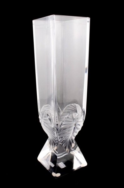 Lalique "Lucca Leaf" Art Glass Table Vase: French, 20th century. Lalique frosted, molded and clear art glass table vase in "Lucca Leaf" pattern with square vertical body with four leaf tips at bottom that cross onto sloped base. Signed on edge