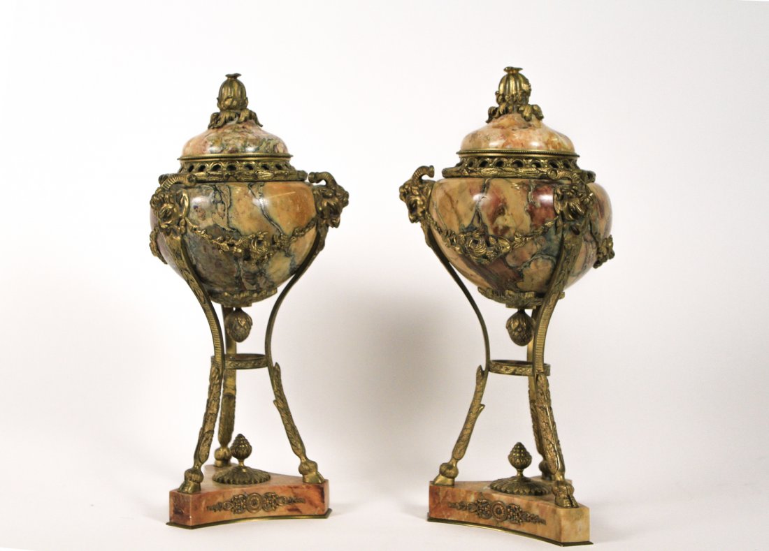 Pair of French Ormolu Mounted Marble Cassolettes: French, 19th Century. Pair of French ormolu mounted marble cassolettes, each with a domed cover with pierced entrelac gallery with berried laurel banding surmounted with pomegranate finial, the body m