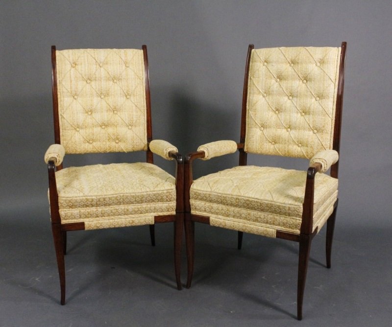 Pair of Tommi Parzinger Upholstered Armchairs: Pair of matching Tommi Parzinger (German/American, 1903â€“1981) mahogany wood framed armchairs in modern streamlined form with rectangular back, arm rests and seat upholstered in butter cream yel
