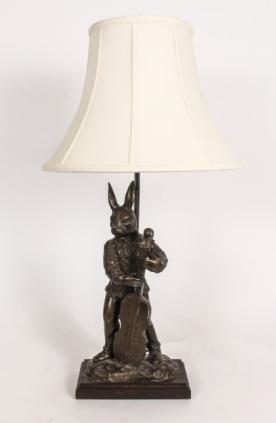 Bronze Rabbit Playing Cello Table Lamp: 20th century. Bronze whimsical animal musician form table lamp with standing rabbit, hare or bunny in rose patterned tunic, pants and boots playing a stringed cello on a naturalistic base further rais