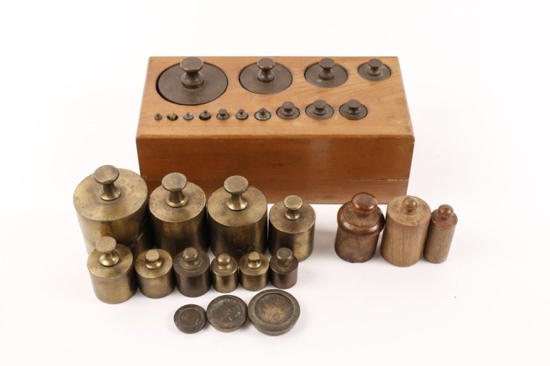 Bronze Weight Set in Wood Box & 10+ Extra Weights: Late 19th/ early 20th century. A collection of weights comprising of a complete set of bronze weights ranging down from 2000 grams, each inscribed on top with measure of weight and fitted in a custom 