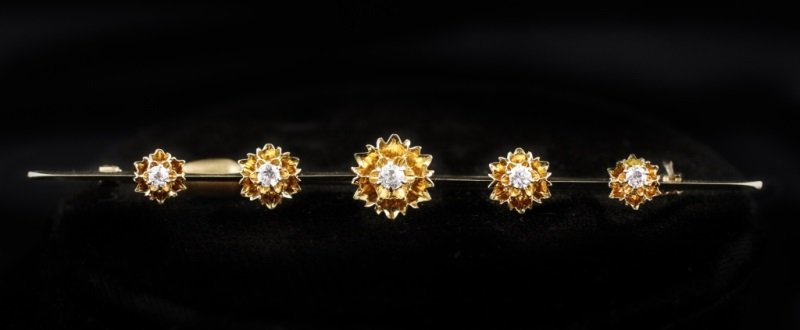 14k Yellow Gold & Old Mine Cut Diamond Bar Pin: Circa 1910-1920, handcrafted bar pin or lapel brooch composed of 14k yellow gold with buttercup settings with five genuine "old mine" cut natural diamonds (approximately 0.27 carat total weight, color