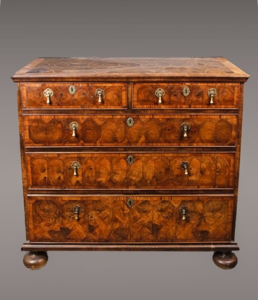 William & Mary Walnut Oyster Veneered Chest: English, Late 17th/Early 18th century. William and Mary walnut oyster veneered chest of drawers, the rectangular top with molded edge and sectional veneer with concentric circular parquetry above two