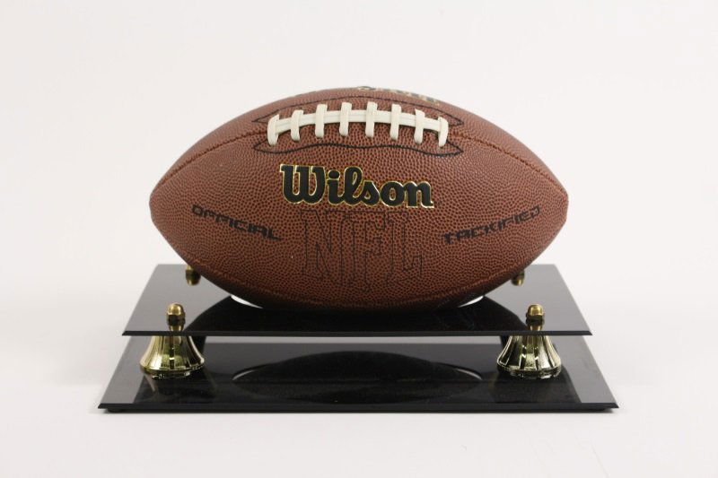 Peyton & Eli Manning Signed Football in Case: Peyton and Eli Manning autographed full size Wilson NFL football. The signatures are very sharp and clear and signed in silver felt tip pen. Football comes with a acrylic clear and black case. Height