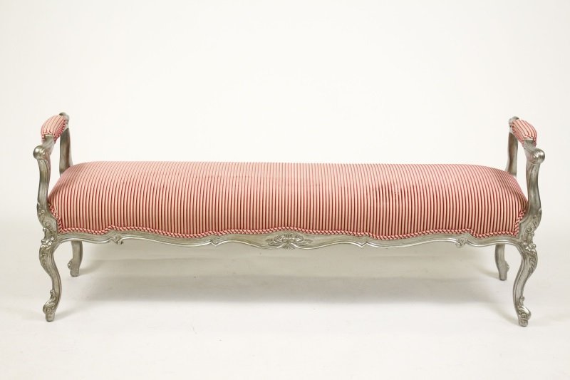 Contemporary French Style Upholstered Window Bench: Contemporary French style window bench with Louis XV style frame with modern silver finish throughout, arm rests and seat upholstered in pink velvet striped upholstery. Underside of settee or bench wi