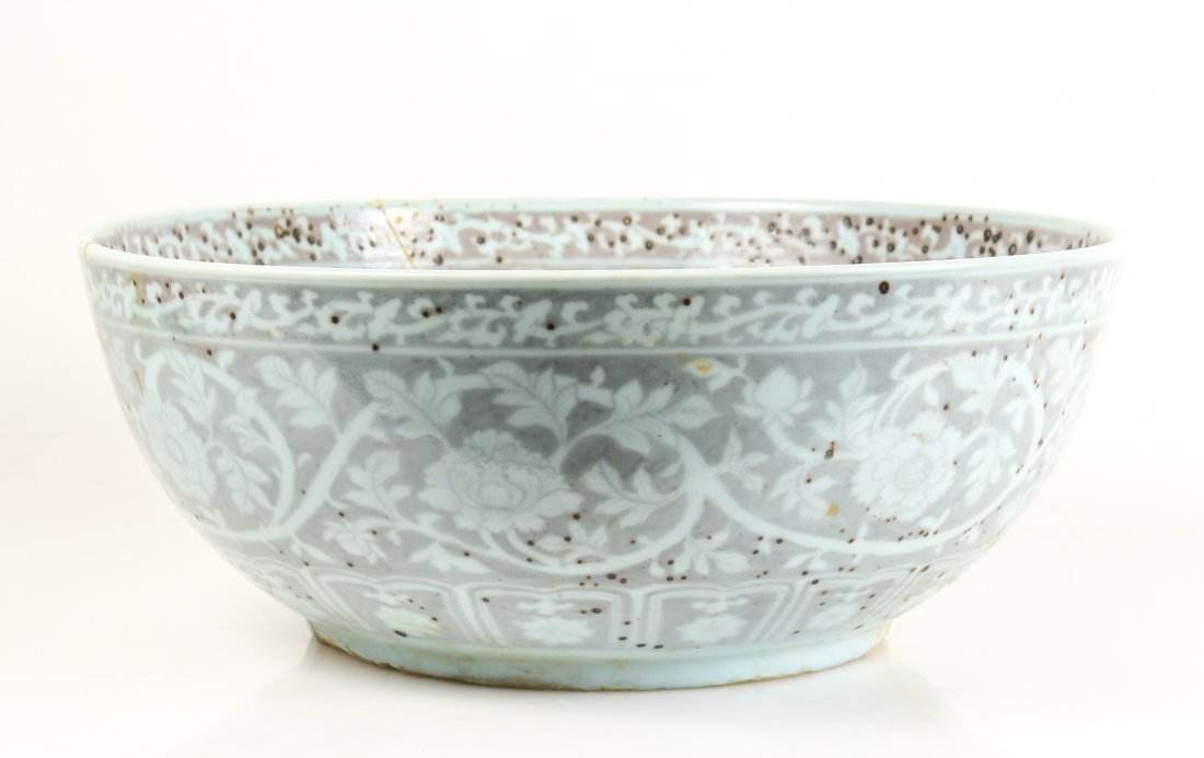 Large Ming Dynasty Style Porcelain Bowl: Chinese Ming Dynasty style, large porcelain bowl with exterior and interior decorated with pale pinkish red floral and scrolled decoration. Unmarked. Height 6.5", diameter 16.3". _x000D_ Please consul