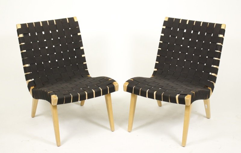 Pair of Jens Risom for Knoll Strap Lounge Chairs: American, mid 20th century. A matched pair of Jens Risom Lounge Chairs designed for Knoll, with black colored elasticized basketweave strapping forming the seat and back on a hardwood frame, likely bi